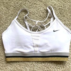 Nike sports bra, gold/gray/black band. Strapped back. Size medium. EUC